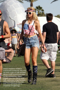Budding model and daughter of Alec Baldwin and Kim Basinger, Ireland Baldwin takes in the atmosphere around Coachella music festival while wearing a US Flag design sleeveless top and complimenting bandana on her head and heart shaped glasses and daisy duke